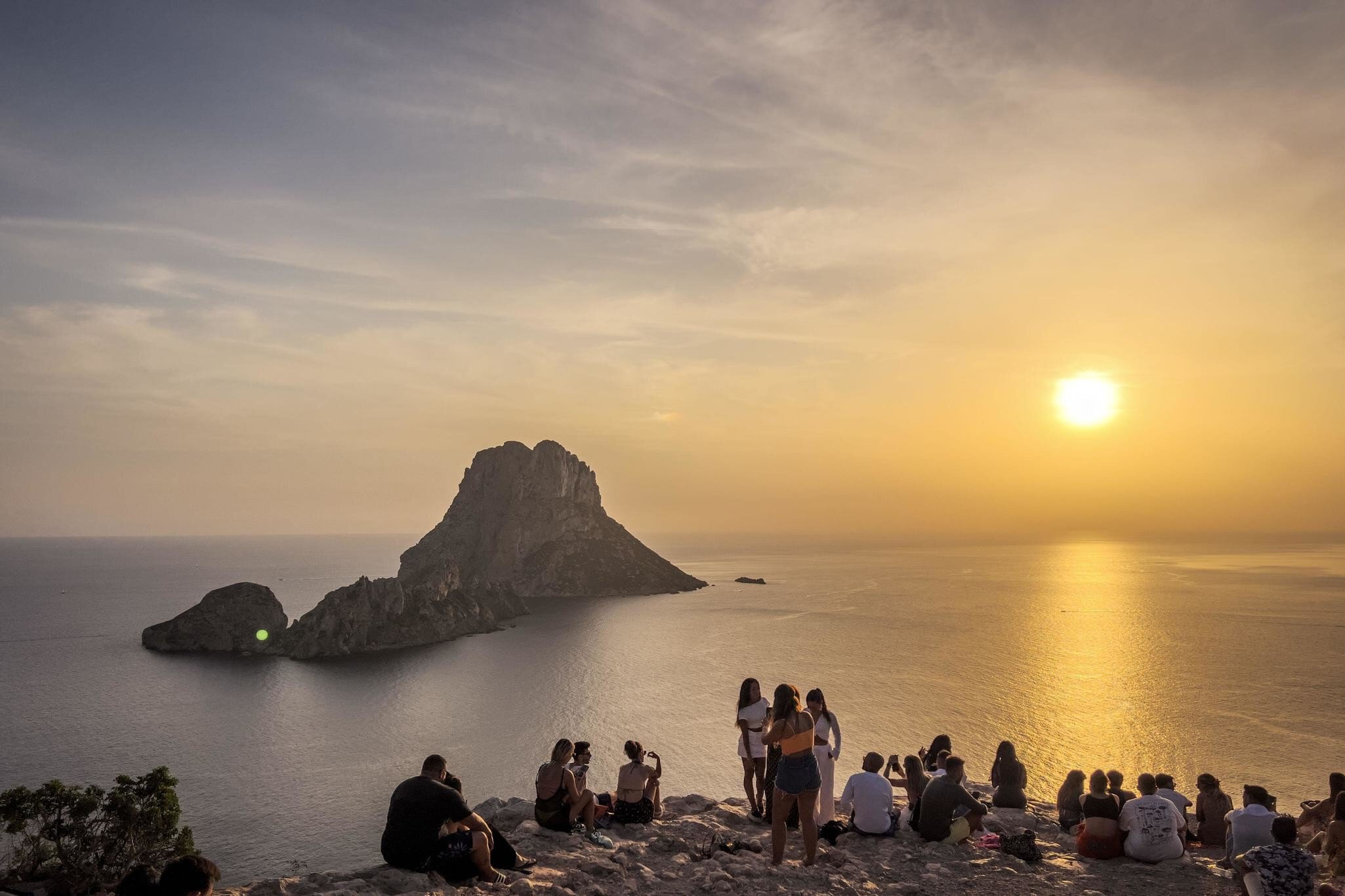 Ibiza, Spain - August 26th 2024 - View of Es Vedra island and people watching sunset Uploaded for App Use
