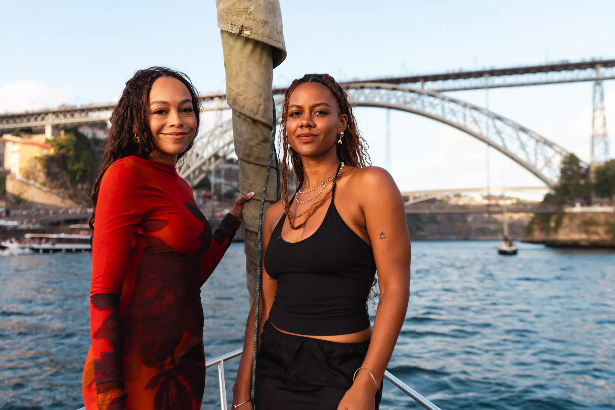 Hunter and Peyton beneath the Dom Luís I Bridge on the Douro River