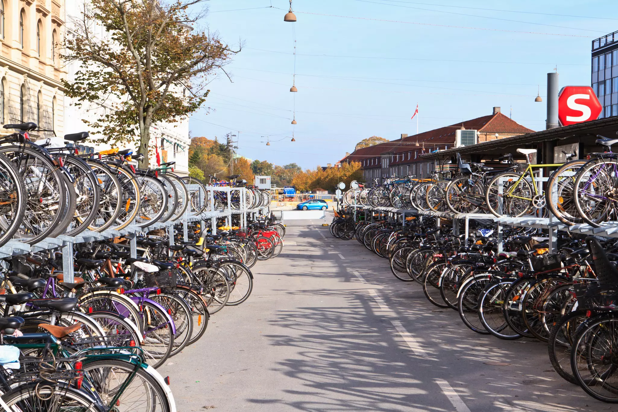 Double-decker racks filled with bicycles.