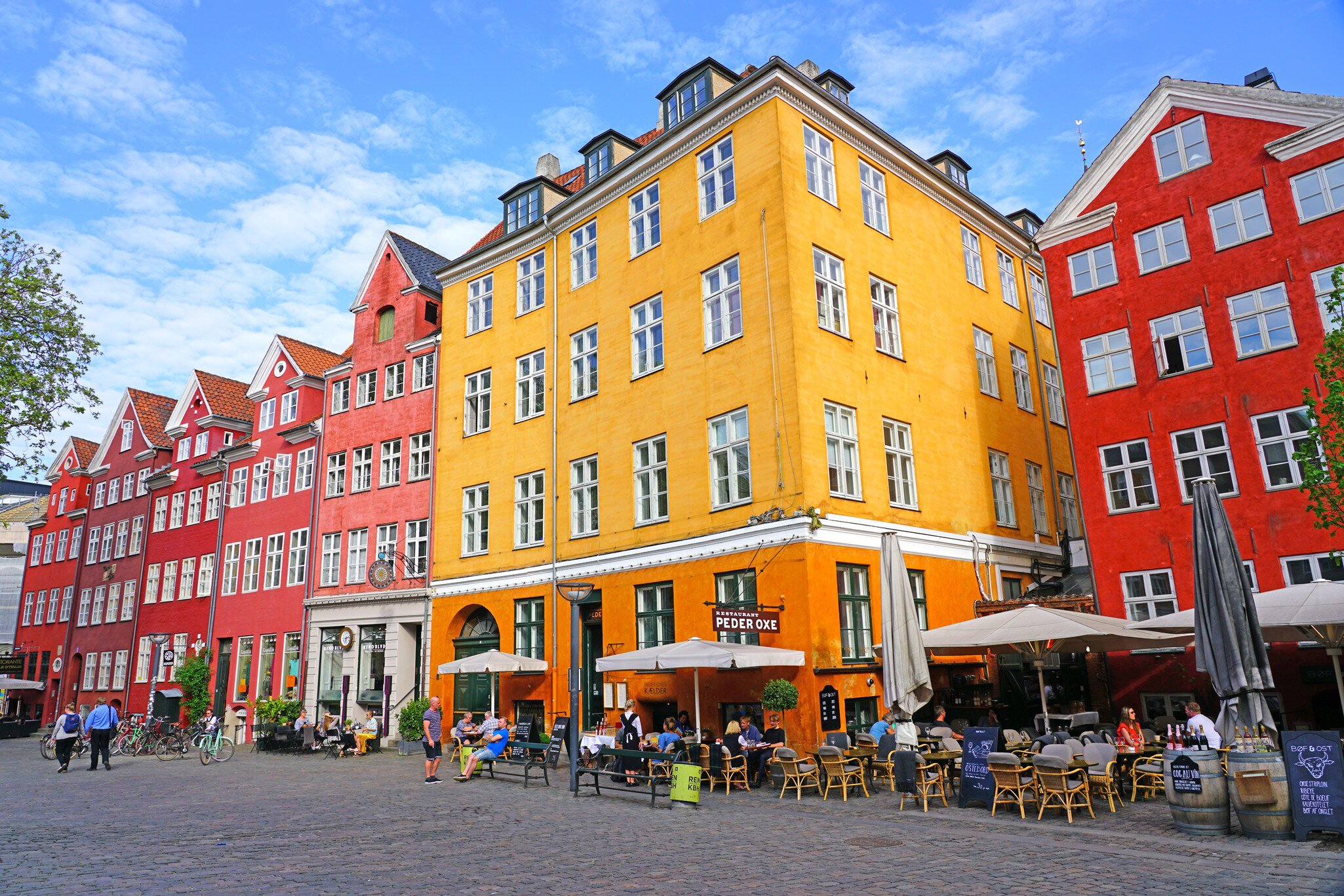 COPENHAGEN, DENMARK -15 MAY 2018- View of colorful buildings lining the Grabrodretorv Square, a landmark public square in Copenhagen, Denmark.
