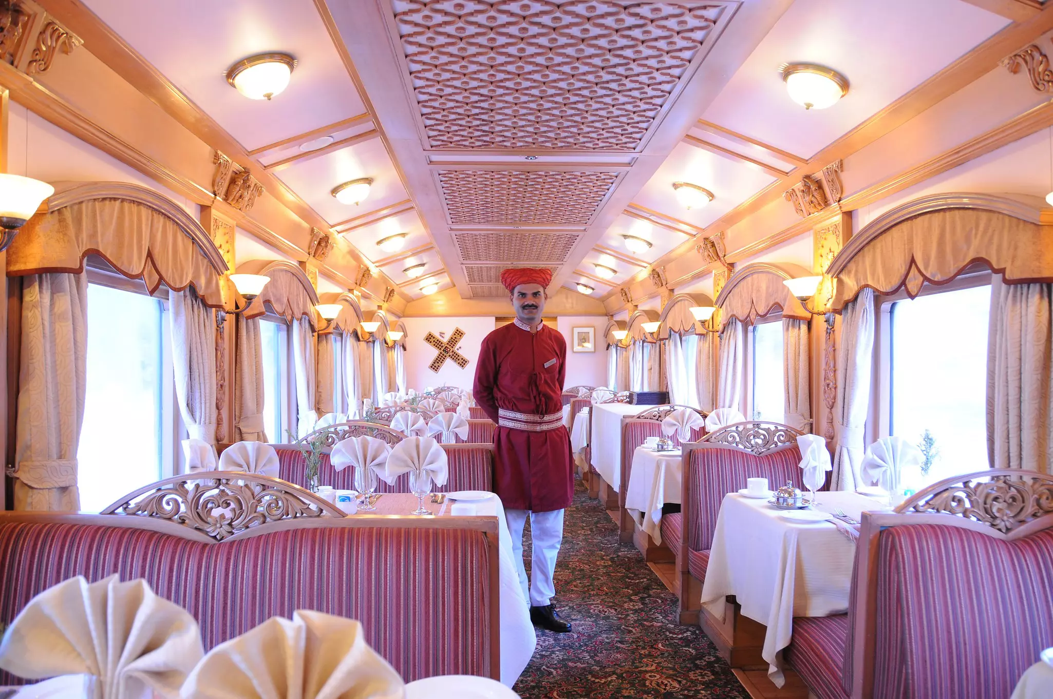 The lavish dining car onboard the Deccan Odyssey train from Delhi to Mumbai