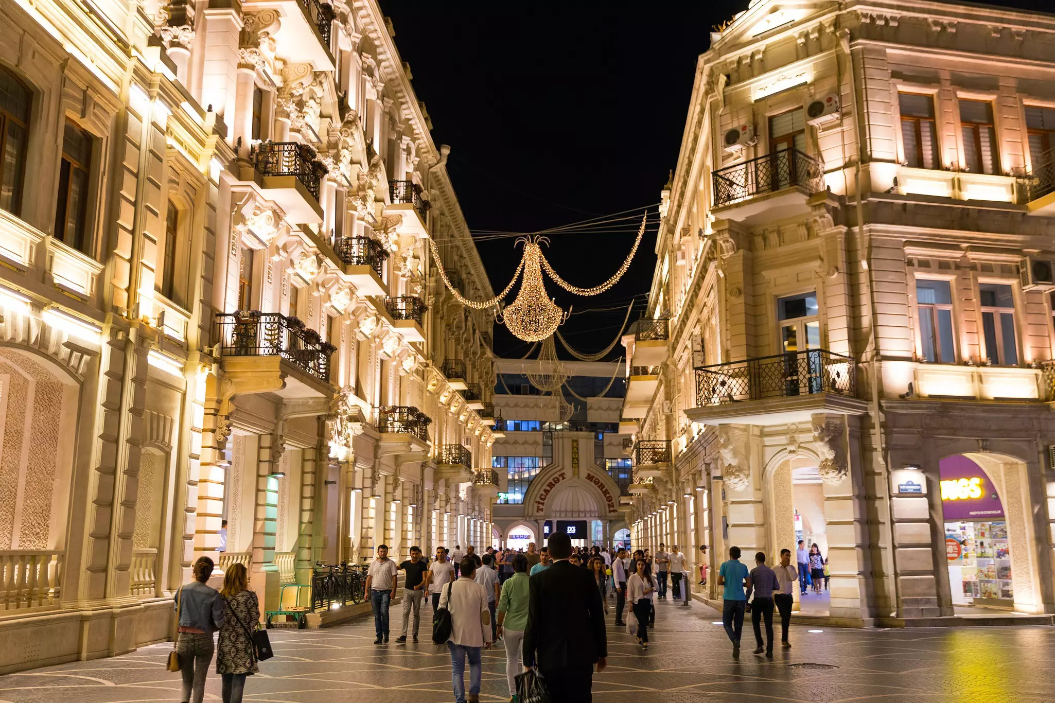 Nizami Street with bright night illumination. Shopping center of Baku