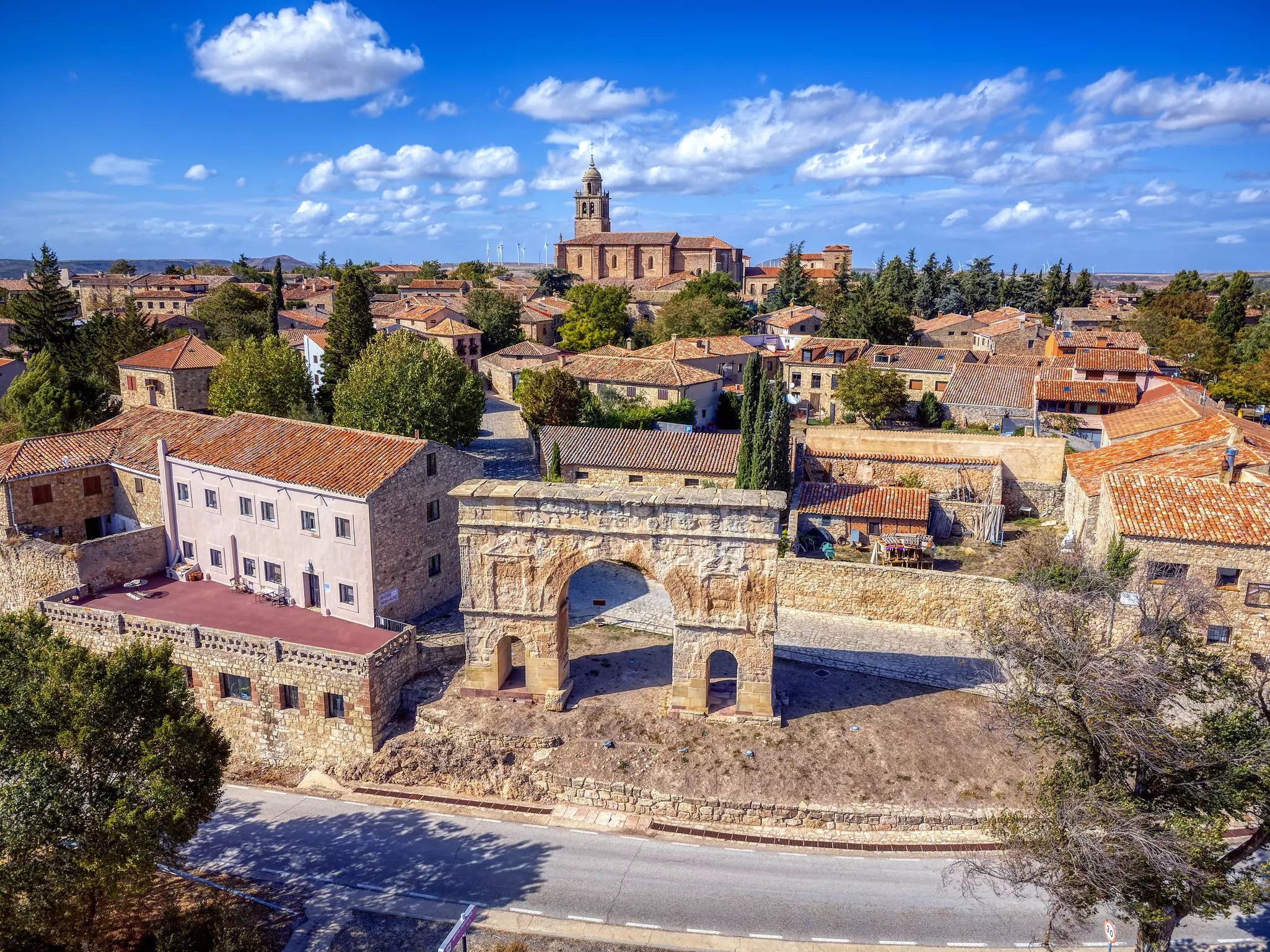 A stone village surrounded by Roman ruins.