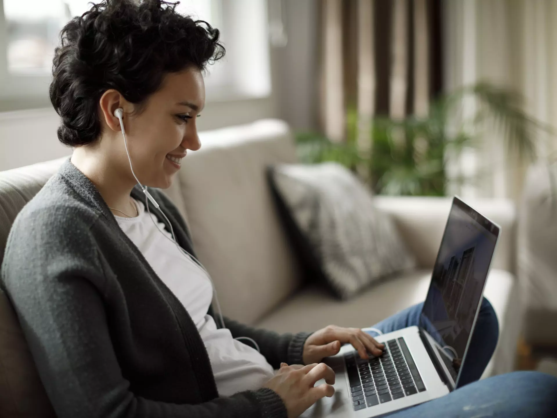 Young woman enjoying good music while working on laptop
1170984232
content