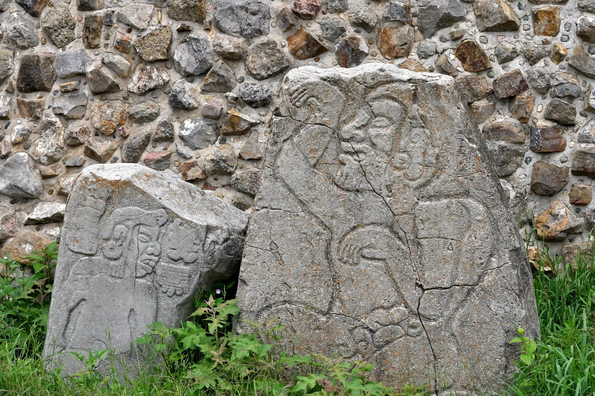 Stone carvings showing figures.