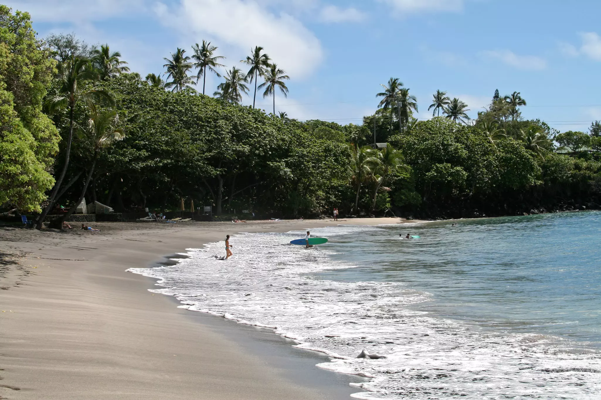 Hamoa Beach, Maui, with a few people in and around the water