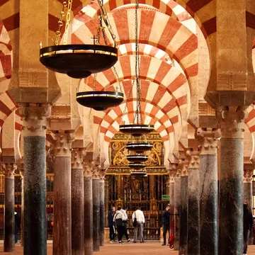 View of the striped arches of the Mezquita in Córdoba, Spain.