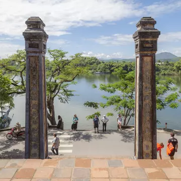 Tourists sightseeing, pilgrim on a summer morning at Thien Mu Pagoda, Hue, Vietnam.