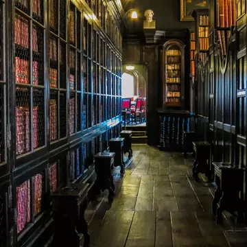 Manchester, United Kingdom - April 22, 2013: People visit John Rylands Library on April 22, 2013 in Manchester, UK. The library opened to public in 1900 and is a Grade I Listed building.