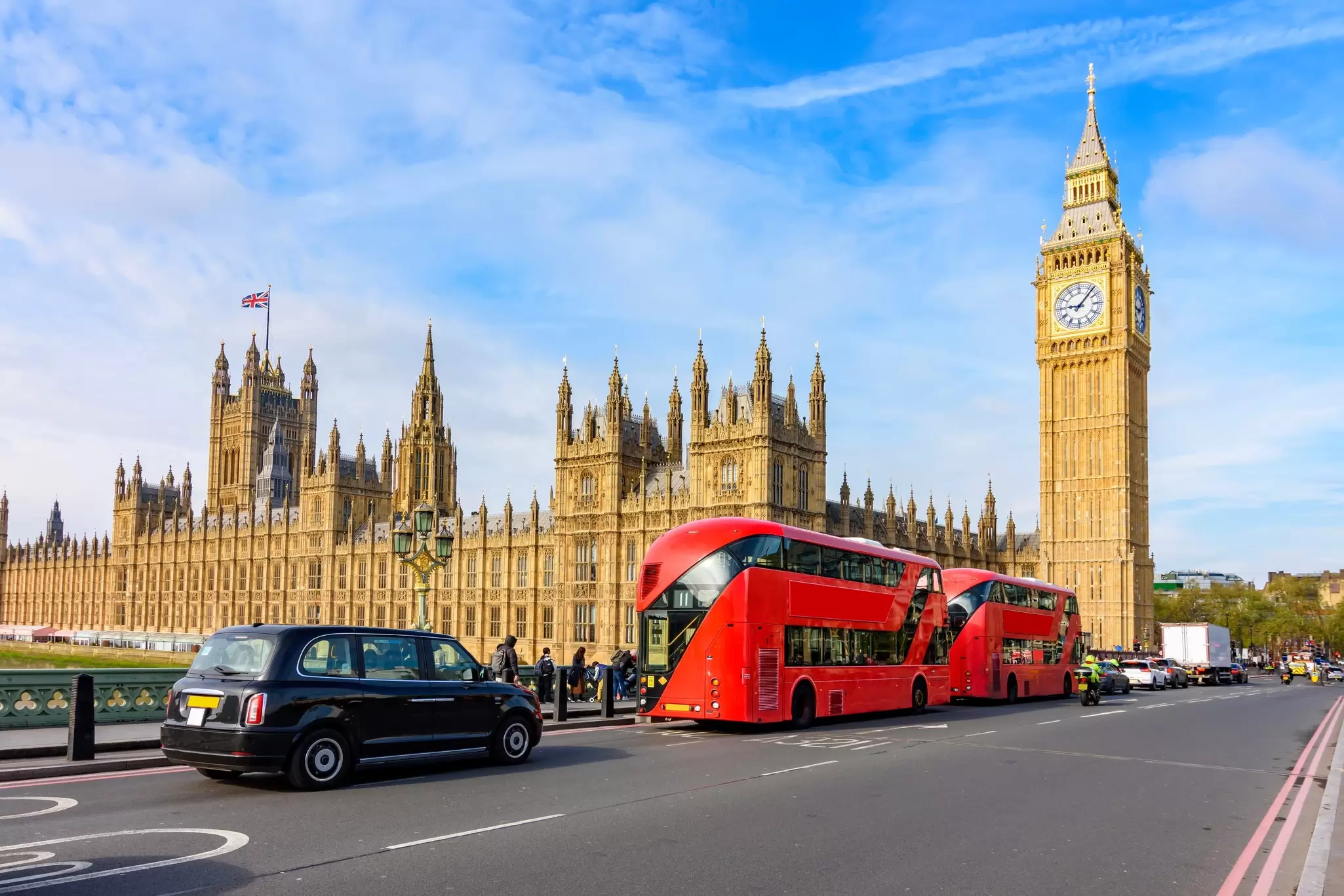 View of the Elizabeth Tower (also known as Big Ben) and Houses of Parliament during a sunny day in London, UK.