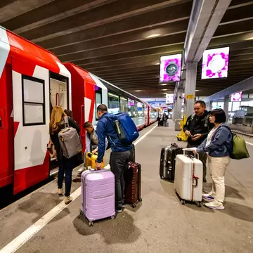 Passengers boarding the Glacier Express train from Zermatt to St Moritz in Switzerland.