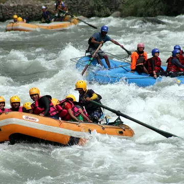 MANALI, INDIA - MAY 13: Tourists enjoying rafting in Beas river at Kullu on May 13, 2015 near Manali, India.  Adventure water sports centre near Kullu provide exhilarating experience for the tourist. Along with rafting enthusiasts can also enjoy activities like Kayaking. (Photo by Aqil Khan/Hindustan times via Getty Images