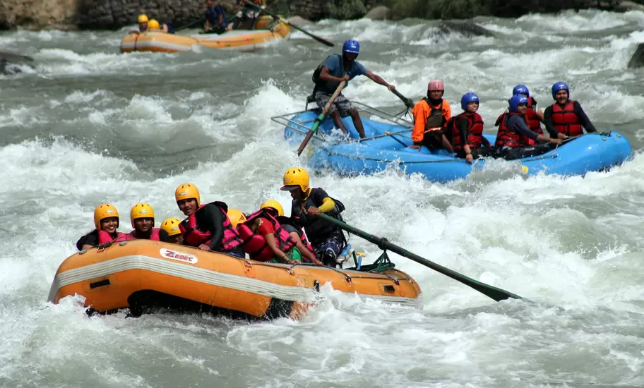 MANALI, INDIA - MAY 13: Tourists enjoying rafting in Beas river at Kullu on May 13, 2015 near Manali, India.  Adventure water sports centre near Kullu provide exhilarating experience for the tourist. Along with rafting enthusiasts can also enjoy activities like Kayaking. (Photo by Aqil Khan/Hindustan times via Getty Images