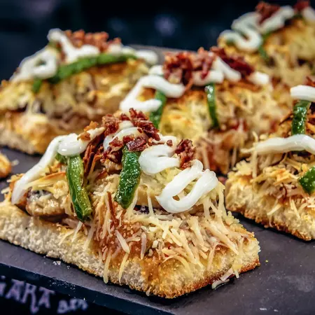 Cheese, pepper and chorizo pintxo on a plate