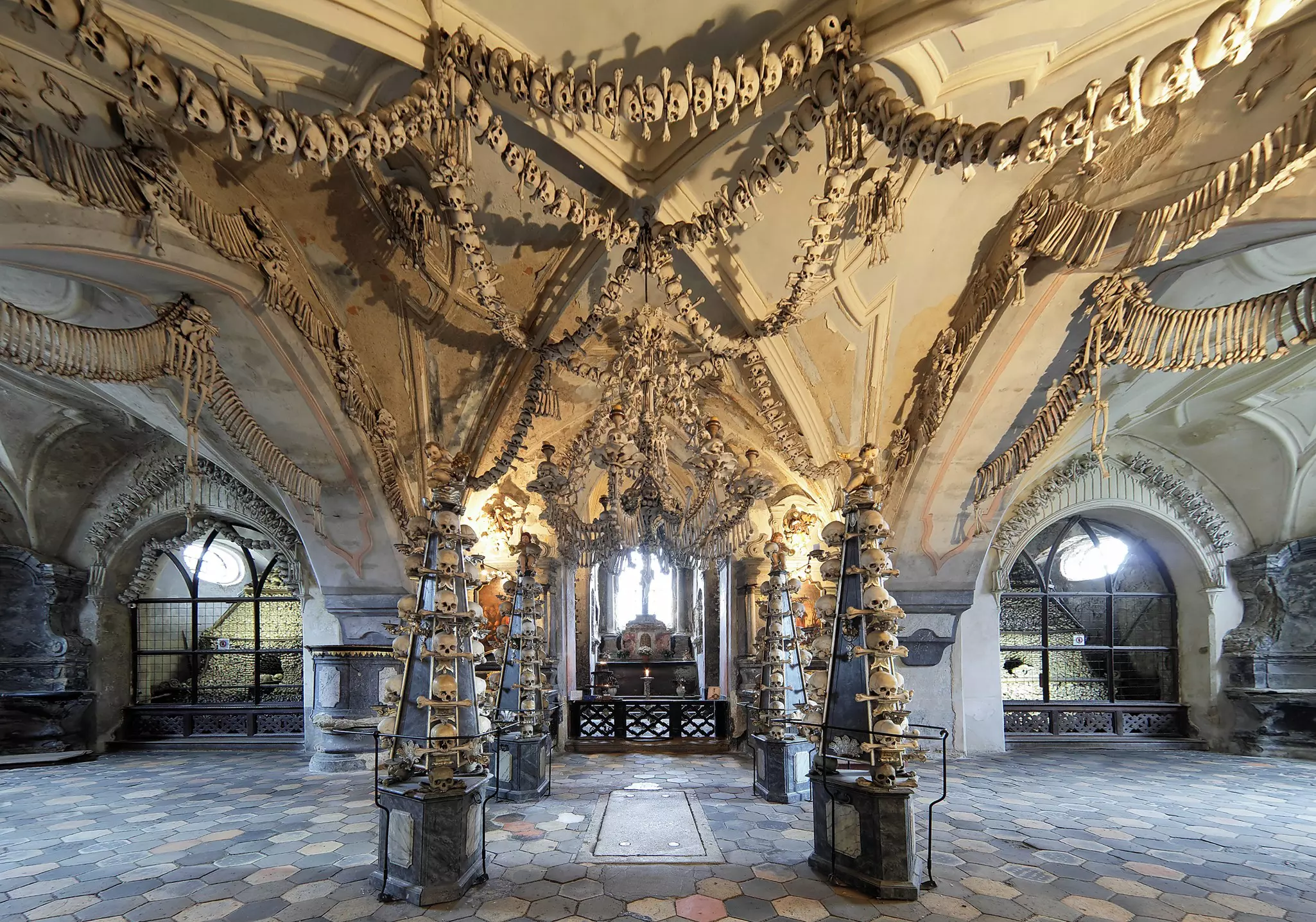An ossuary decorated with skulls and bones.