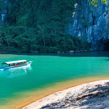 A boat heading into Phong Nha Cave in Phong Nha-Ke Bang National Park, Vietnam. Westend61/Getty Images