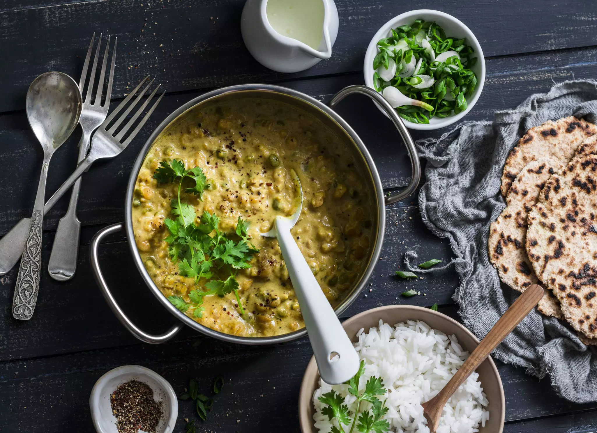 Top view of Indian dhal with jasmine rice, coriander and whole grain flatbread