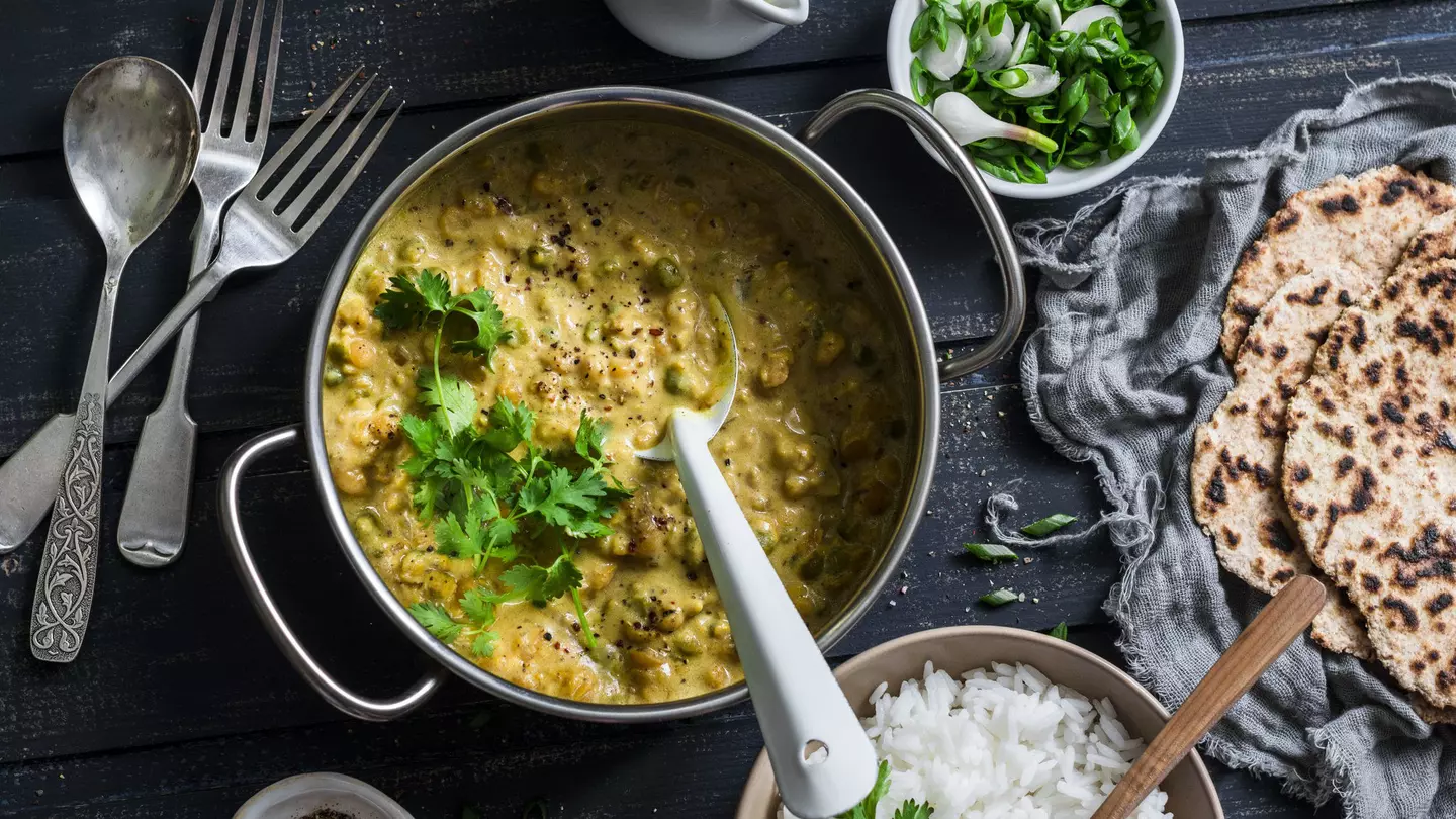 Top view of Indian dhal with jasmine rice, coriander and whole grain flatbread