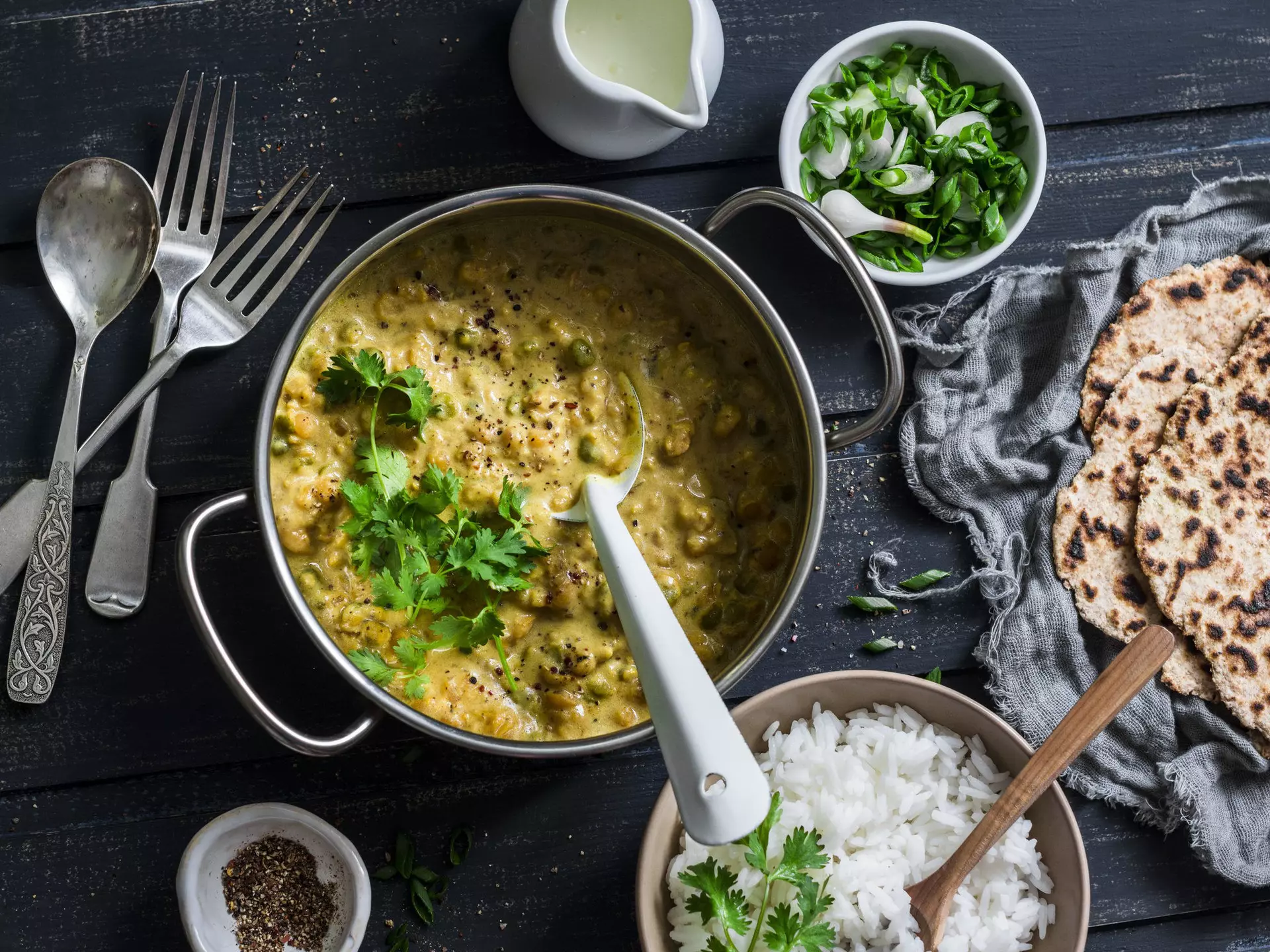 Top view of Indian dhal with jasmine rice, coriander and whole grain flatbread