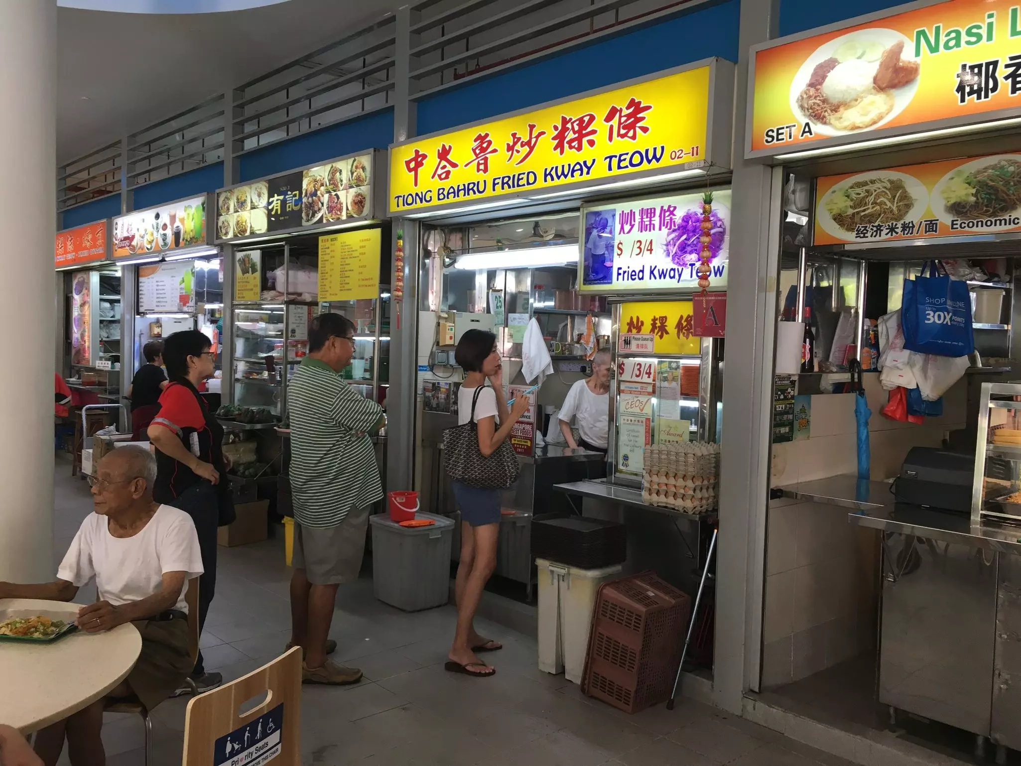 People waiting for food at Tiong Bahru Food Centre, Singapore. 