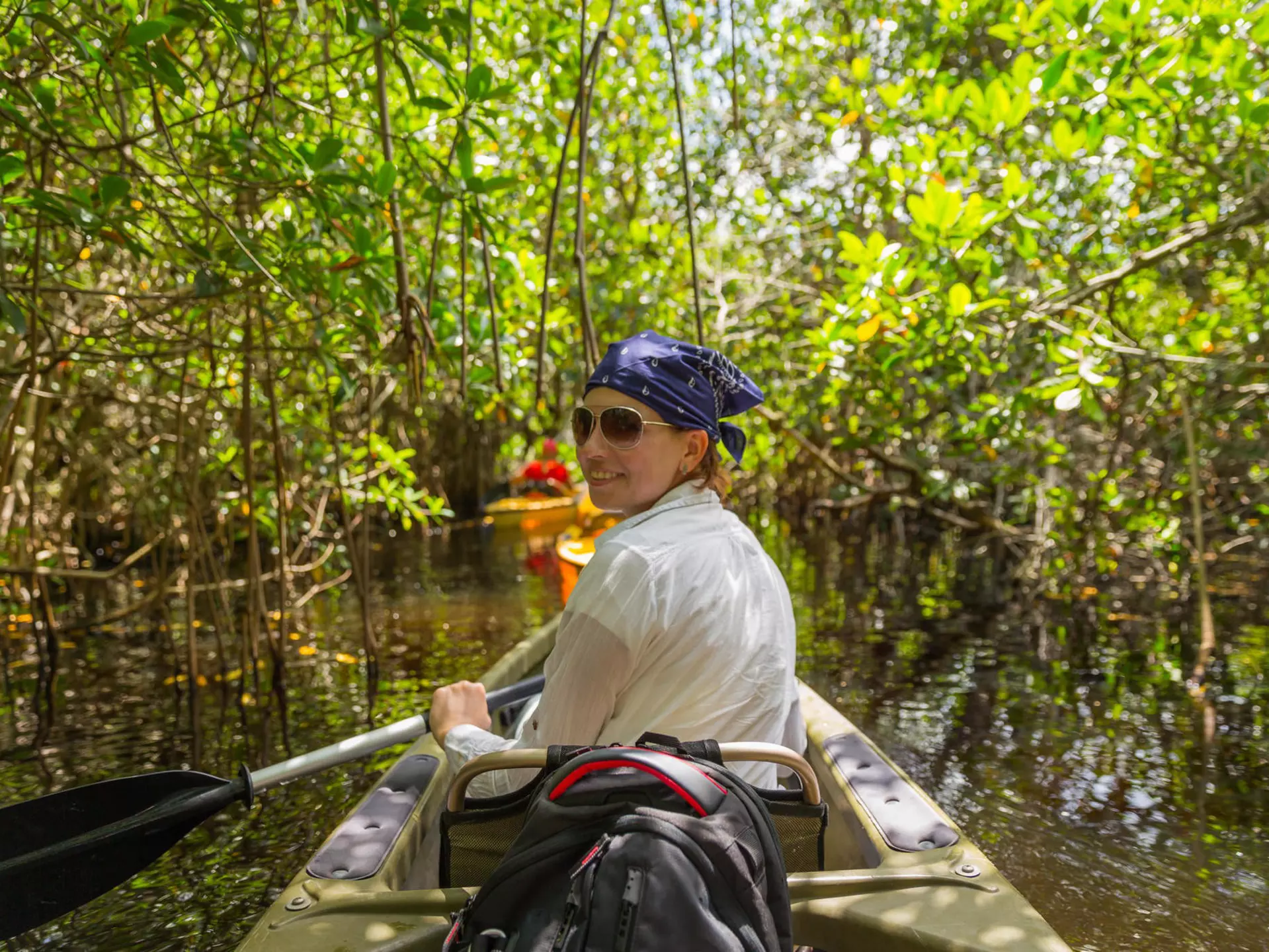 Woman kayaking at a mangrove forest in the Everglades.
1049433338
Canoe, Forest, Fun, River, Famous Place, Resting, Mangrove Tree, Kayaking, Lake, USA, Tourism, Transportation, Nautical Vessel, Oar, Mangrove Forest, Enjoyment, Swamp, Exercising, Trail, Leisure Activity, Natural Parkland, Tropical Climate, Gulf Coast States, Canoeing, Pursuit - Concept, Russia, Relaxation, Sport, Florida - US State, Landscape - Scenery, Outdoors, Recreational Pursuit, Footpath, Swimming, Paddling, Everglades National Park, Water, Kayak, Vacations, People, Travel, Adventure, Travel Destinations, Horizontal, Tunnel, Photography, Reflection, Nature, Rainforest, Relaxation Exercise, Summer, Lifestyles, Sea Channel