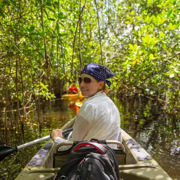 Woman kayaking at a mangrove forest in the Everglades.
1049433338
Canoe, Forest, Fun, River, Famous Place, Resting, Mangrove Tree, Kayaking, Lake, USA, Tourism, Transportation, Nautical Vessel, Oar, Mangrove Forest, Enjoyment, Swamp, Exercising, Trail, Leisure Activity, Natural Parkland, Tropical Climate, Gulf Coast States, Canoeing, Pursuit - Concept, Russia, Relaxation, Sport, Florida - US State, Landscape - Scenery, Outdoors, Recreational Pursuit, Footpath, Swimming, Paddling, Everglades National Park, Water, Kayak, Vacations, People, Travel, Adventure, Travel Destinations, Horizontal, Tunnel, Photography, Reflection, Nature, Rainforest, Relaxation Exercise, Summer, Lifestyles, Sea Channel