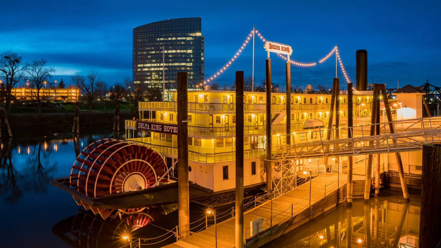 The permanently moored Delta King steamboat by night, now a hotel in Downtown Sacramento, California, USA