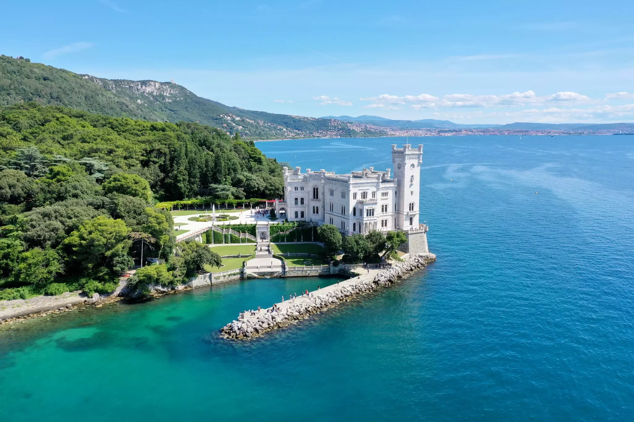 The Castello di Miramare, surrounded by blue waters, in Trieste, Italy.