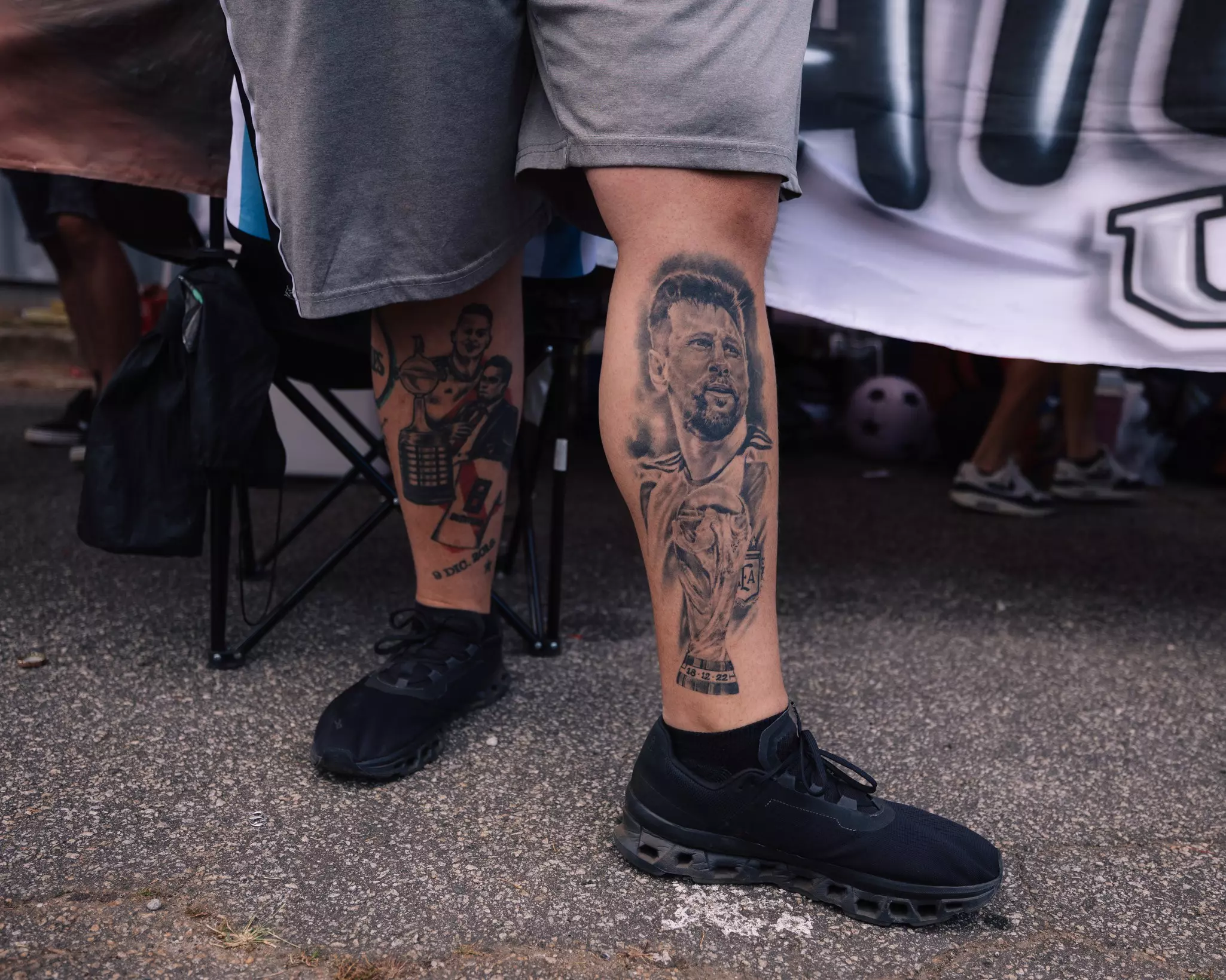 An Argentinian supporter shows his tattoo of Lionel Messi before the 2024 Copa America opening match.