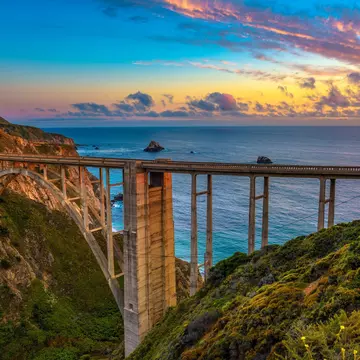 Bixby Bridge spans the Pacific Coast Highway at sunset near Big Sur in California, USA.