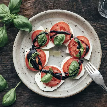 Caprese salad isn't just limited to tomatoes – use whatever's local and in season. Westend61 / Getty Images