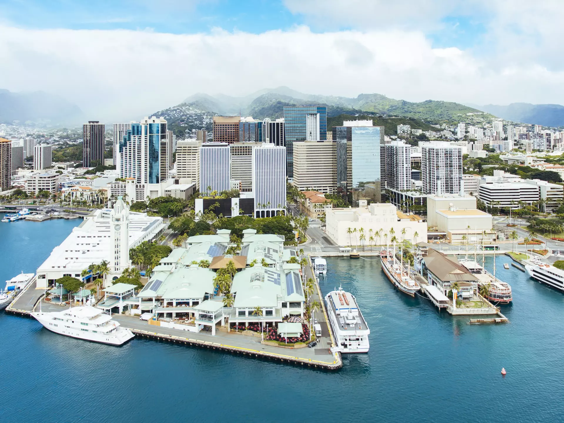 Aerial of Honolulu Harbor, Aloha Tower & Marketplace and the downtown city skyline.
1160560358
Business, Travel Destinations, Horizontal, Famous Place, Panoram, Panoramic, Beach, Hotel, Skyscraper, Travel, Vacations, Market - Retail Space, Honolulu, Color Image, Nature, Built Structure, Backgrounds, Cloud - Sky, Aloha Tower, Aerial View, Clock Tower, Cruise Ship, Summer, Marina, Town, Office, Oceania, Urban Skyline, Photography, City, Hawaii Islands, Mountain Range, Sky, Nautical Vessel, Oahu, Copy Space, Passenger Craft, Pacific Islands, Day, Tropical Climate, Island, City Life, Building Exterior, Sea, No People, Landscape - Scenery, Cityscape, Architecture, Outdoors, Bay of Water, Pacific Ocean, Mountain, Blue, Coastline, Harbor, USA, Water