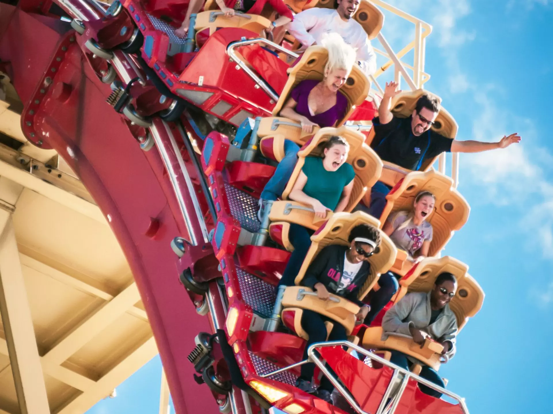 A tall sailing ship coasts the playa at sunset