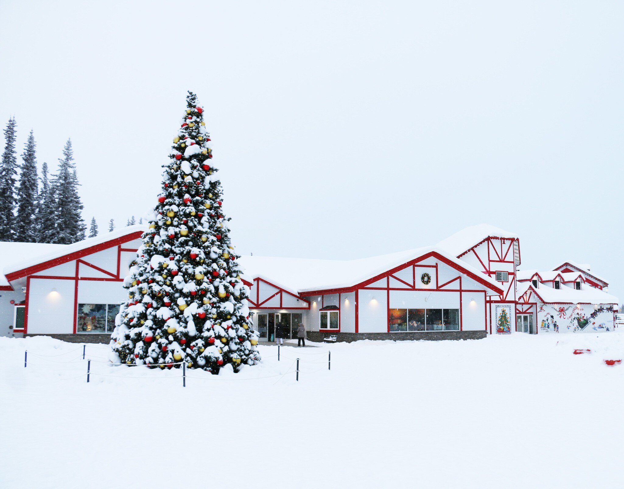 **RIGHTS MANAGED** email info@santaclaushouse.com Santa Claus House during the winter with snow and tree