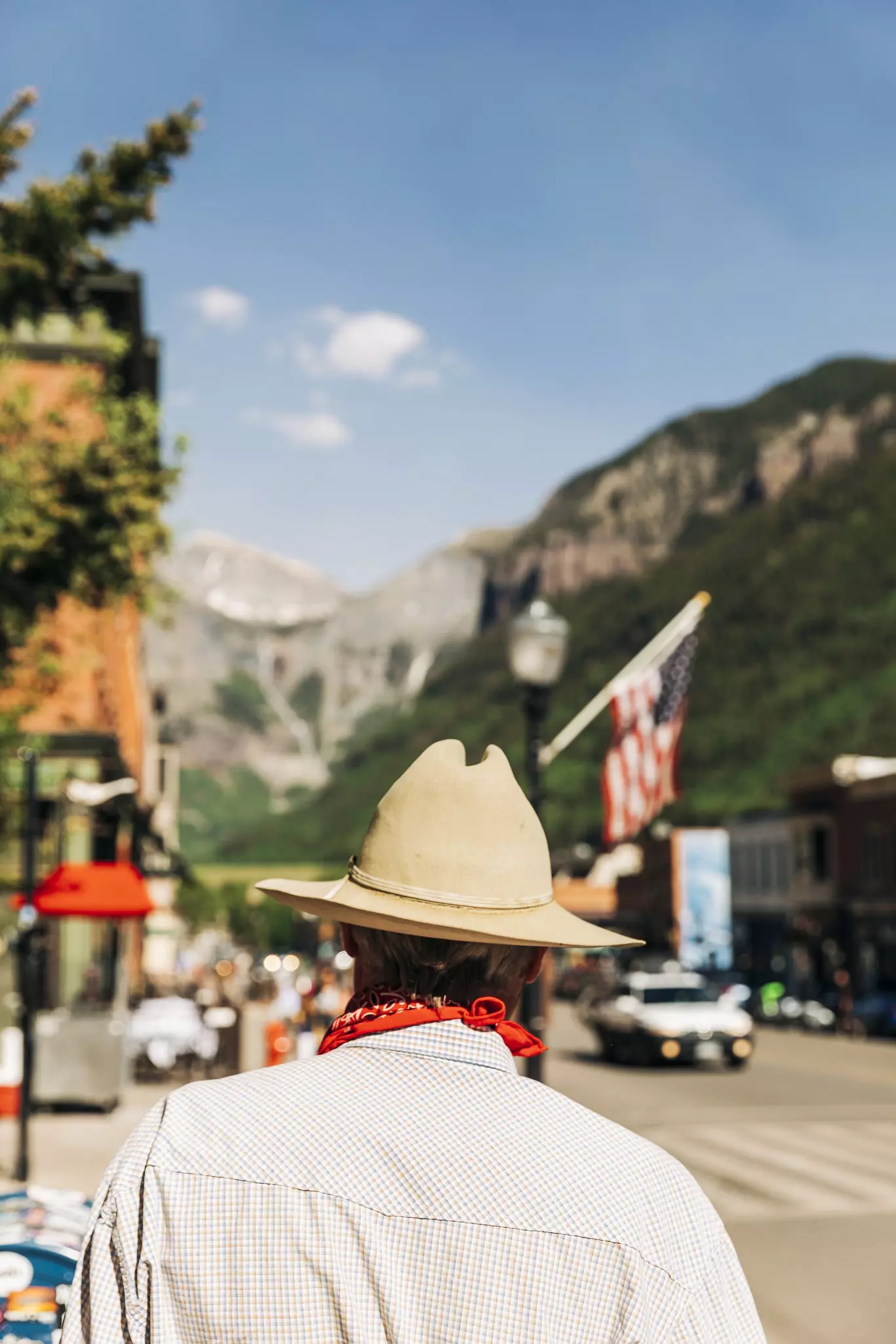 Man in cowboy hat on street in Telluride