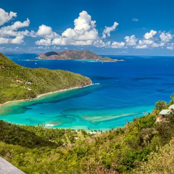 Views like this one of Brewers Bay are one of the many reasons to visit the British Virgin Islands. BVI Tourism.