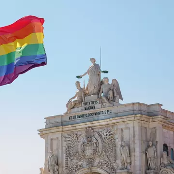 Pride flag in Lisbon, Portugal. Rainbow flag, LGBT flag on Praça do Comércio, Commerce square in front of Rua Augusta Arch, Arco da Rua Augusta. Pride month in June., License Type: media, Download Time: 2025-12-01T16:30:47.000Z, User: dermothegarty77, Editorial: false, purchase_order: 56530 - Guidebooks, job:  Global Publishing WIP, client: Western Europe 16, other: Dermot Hegarty