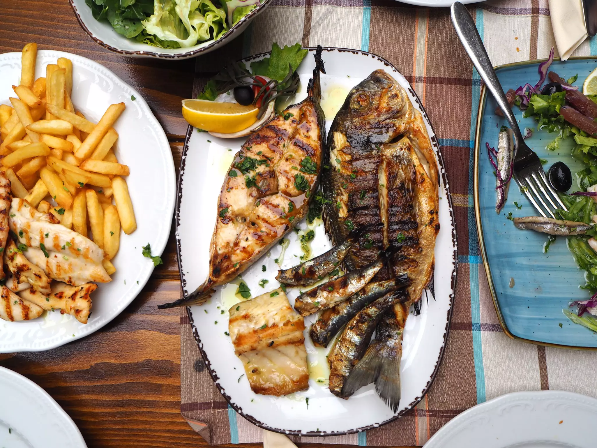 White-fleshed sea breams and sea bass are regarded and priced as delicacies, while oilier bluefish is far less costly © Flycatcher / Shutterstock