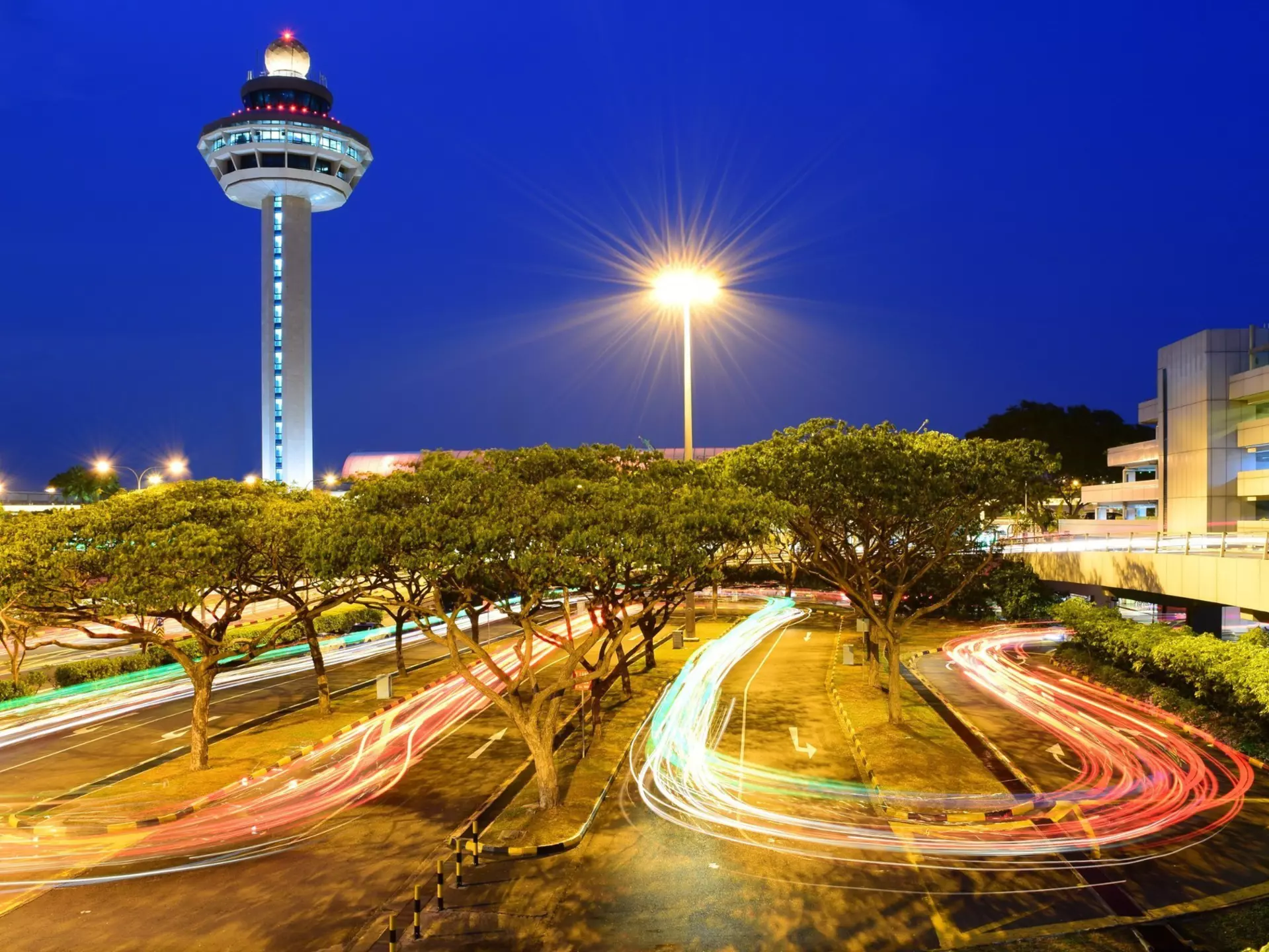 A traveler wearing PPE at Changi Airport