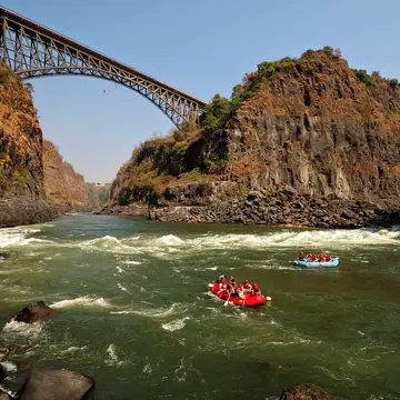 Rafters on the Zambezi River near Victoria Falls Bridge