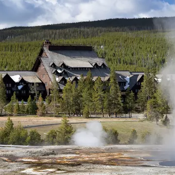 At lodges like the Old Faithful Inn in Yellowstone National Park, the accommodations are almost as grand as the scenery. Almost © VCNW / Shutterstock