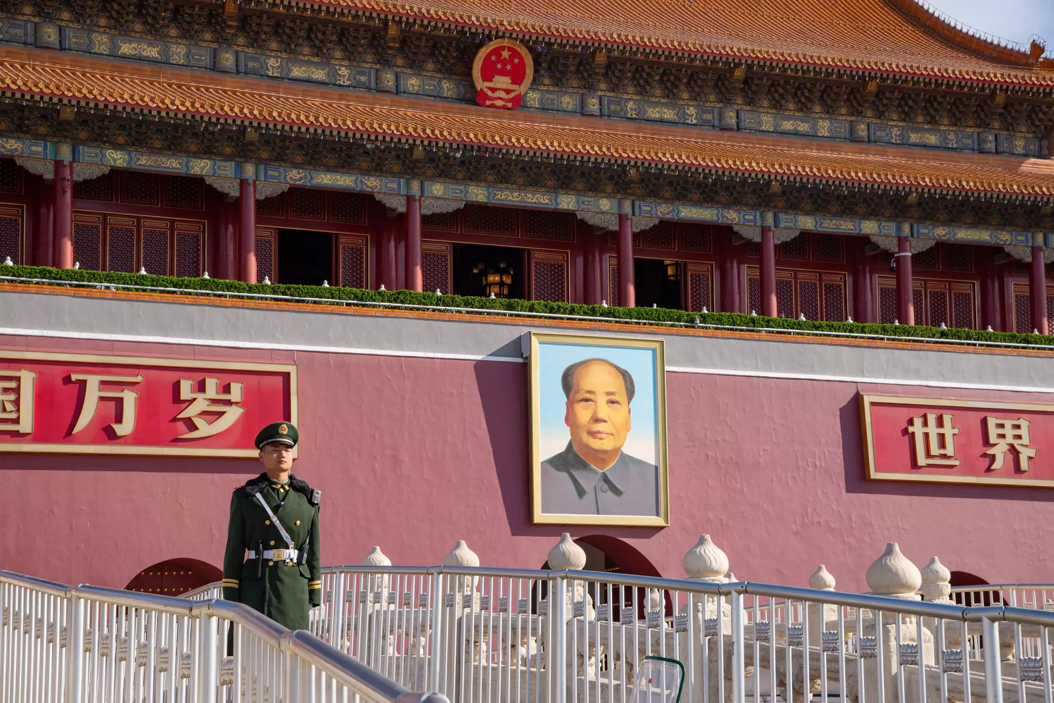A soldier keeps watch over Tiananmen Square in front of the Gate of Heavenly Peace, Beijing, China.