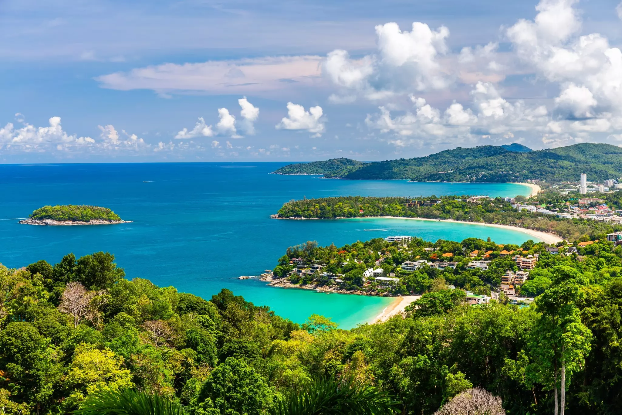 Three bays of blue waters near lush, green shores