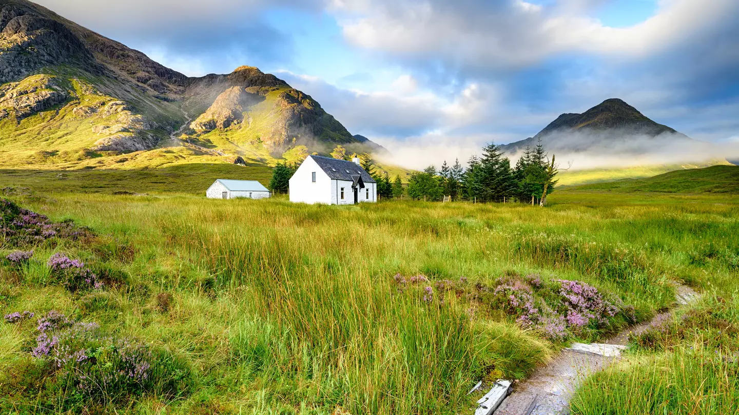 A picture postcard cottage at Glencoe in the Scottish Highlands.
