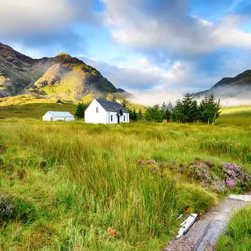 A picture postcard cottage at Glencoe in the Scottish Highlands.