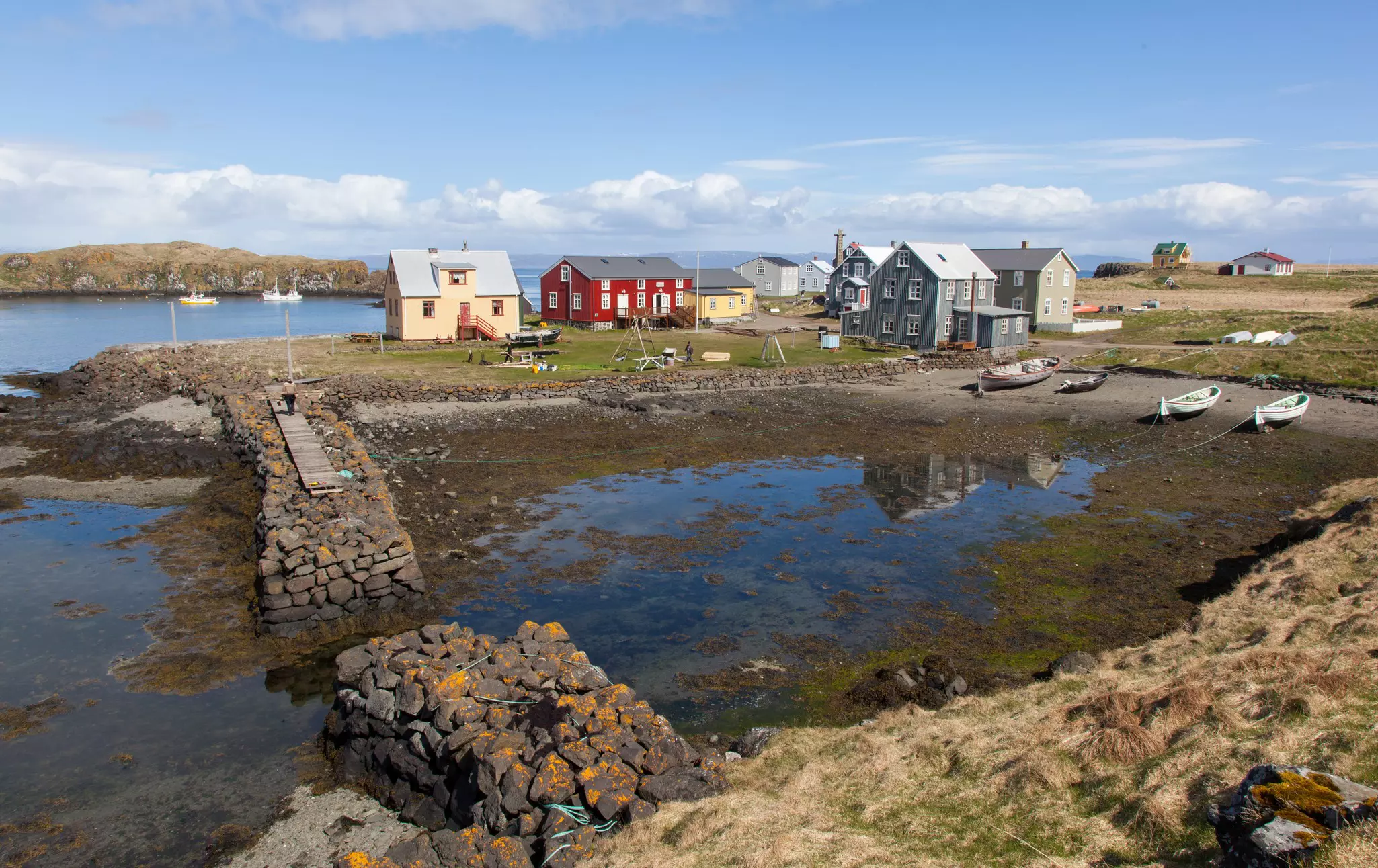 A tiny harbor on an island with a handful of fishing cottages