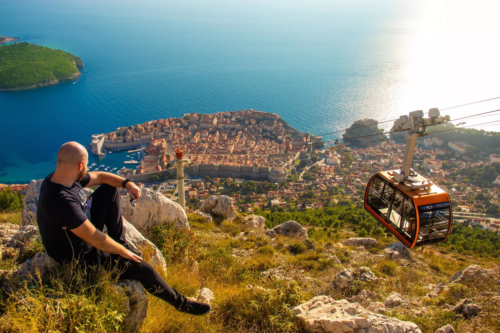 A man watching the cable car at Srđ in Dubrovnik.