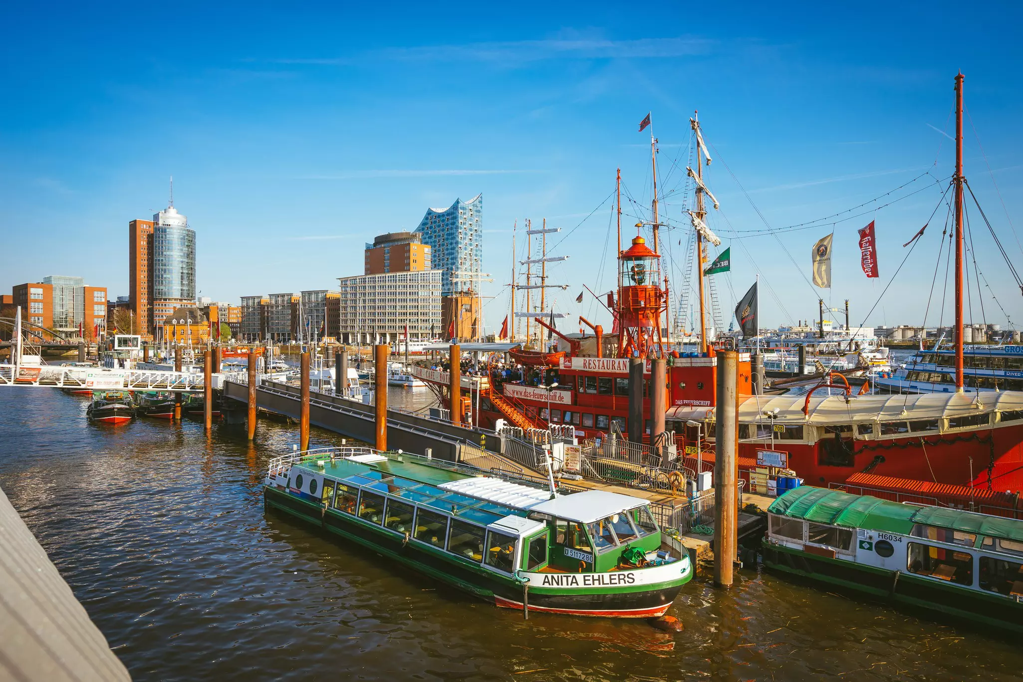 Boats docked at HafenCity quarter in the Speicherstadt district, Hamburg, Germany.