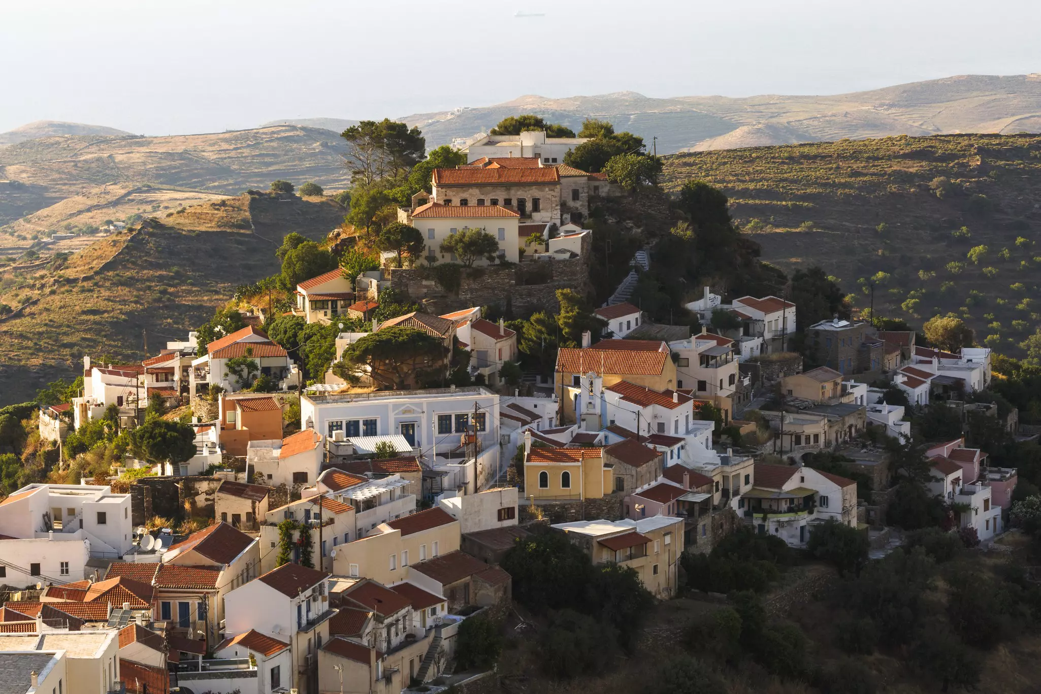 View of hilltop village at sunrise