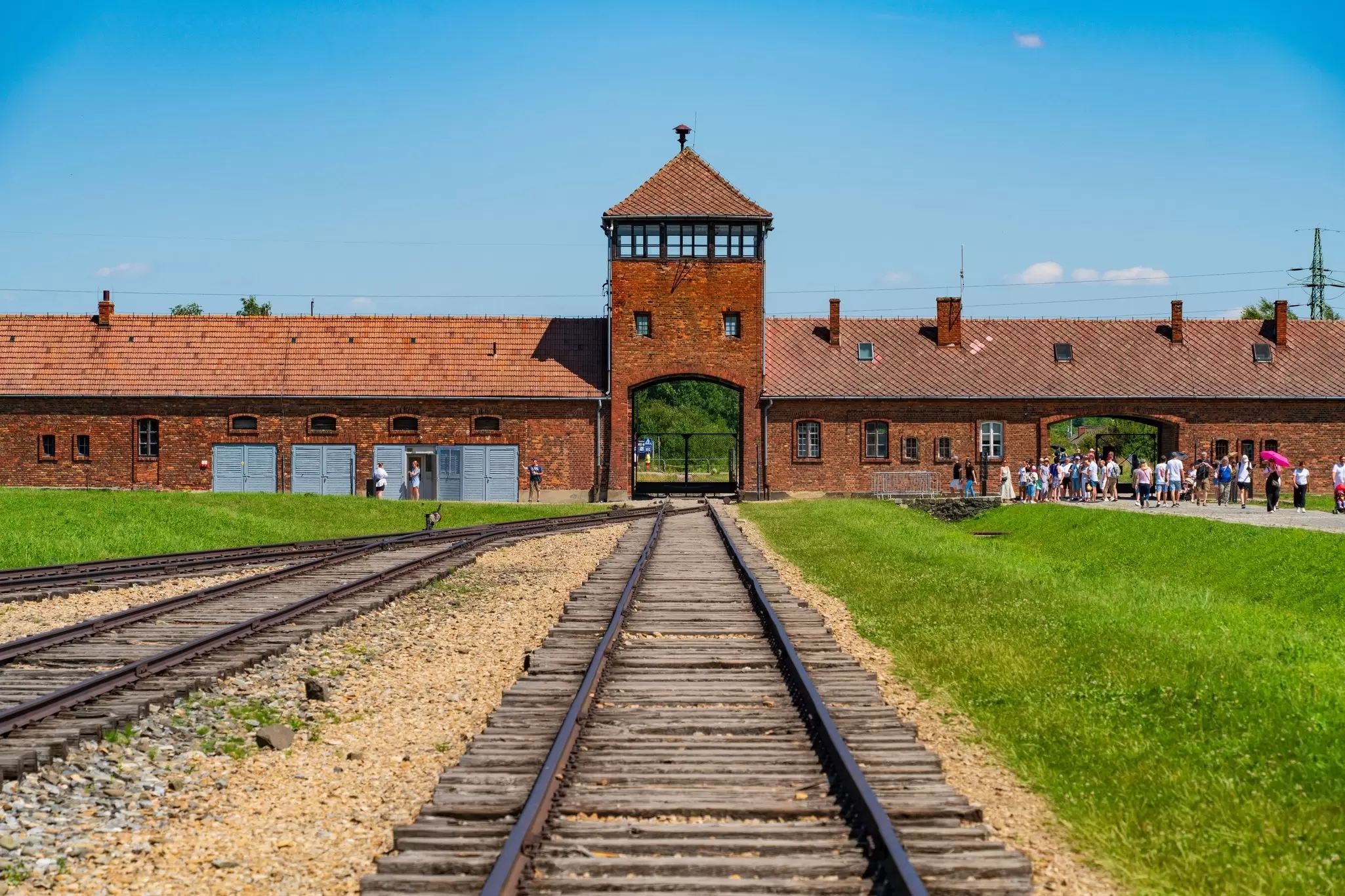 Railway tracks lead to the gate house at Auschwitz II-Birkenau concentration camp in Poland. 